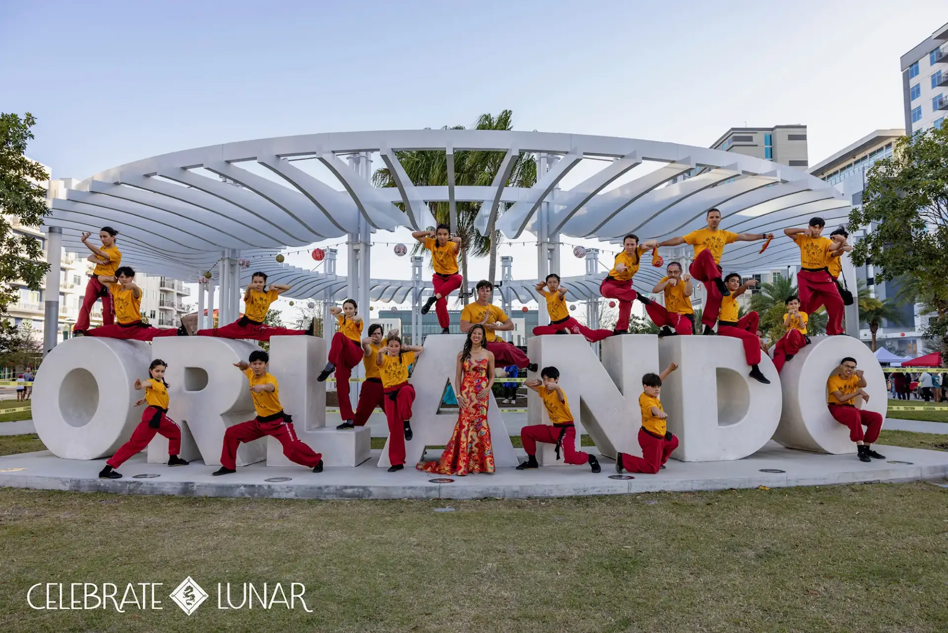 Kung fu students posing on the Orlando sign